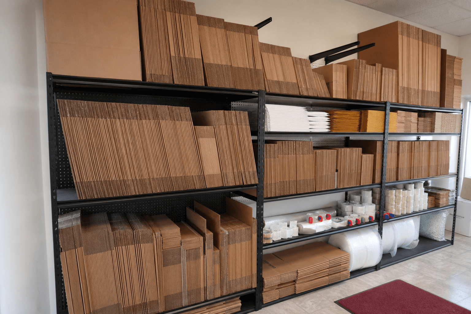 Wall of new shipping boxes and packing supplies in every size